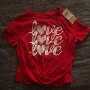 A red shirt that says love on 3 times in size smal